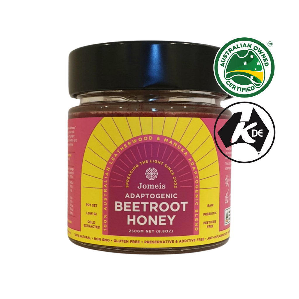 A 250 g Adaptogenic Beetroot Honey. It is sitting on a white, plain background. The tub's label is pink and yellow.