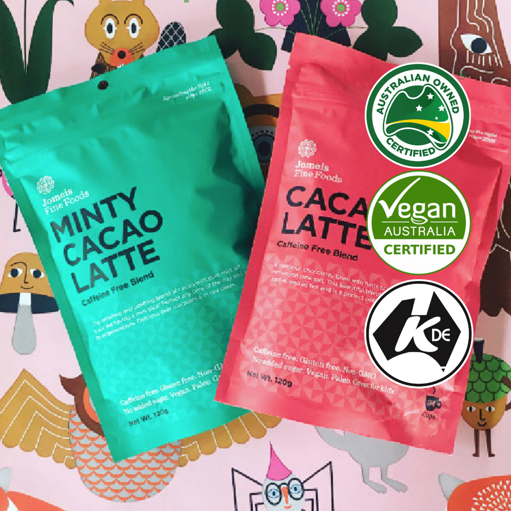 A minty cacao latte packet and a cacao latte packet laying on a childish background. The background features storybook type creatures, including a squirrel, mushroom and spider. 