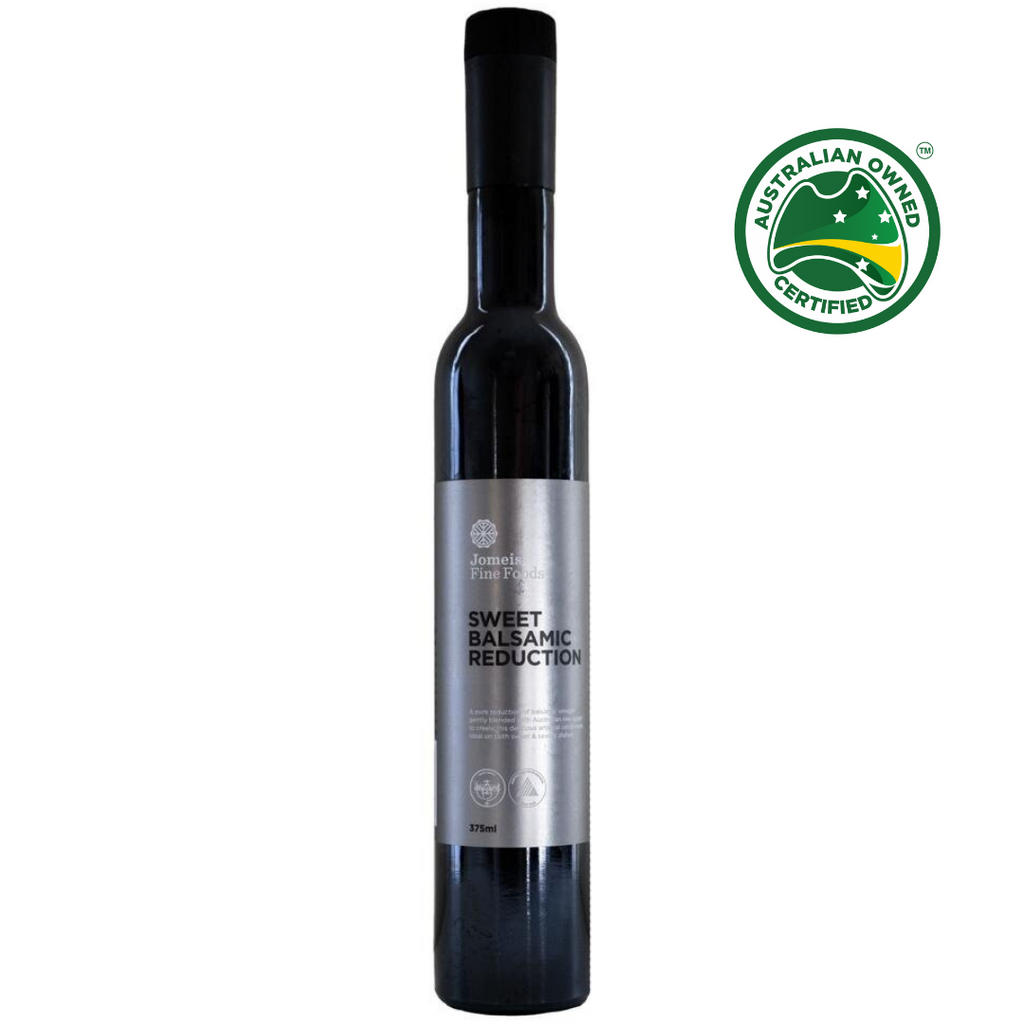A jomeis fine foods 375 ml sweet balsamic reduction. It has a silver label. It is resting on a white background 
